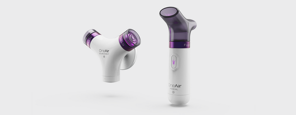 Two OneAir devices, one for environmental monitoring and one for medical use, with white bodies and purple accents. The environmental monitor has two arms labeled "Radon" and "Mold," while the medical device has a single, angled tip labeled "FluA" and a button with a purple light icon.